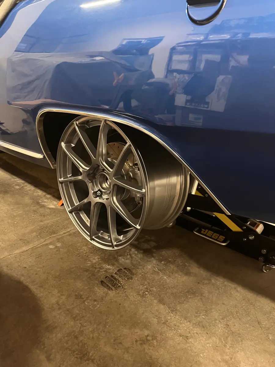 Test fitting the rear wheel prior to mounting tire - 1973 Dodge Dart